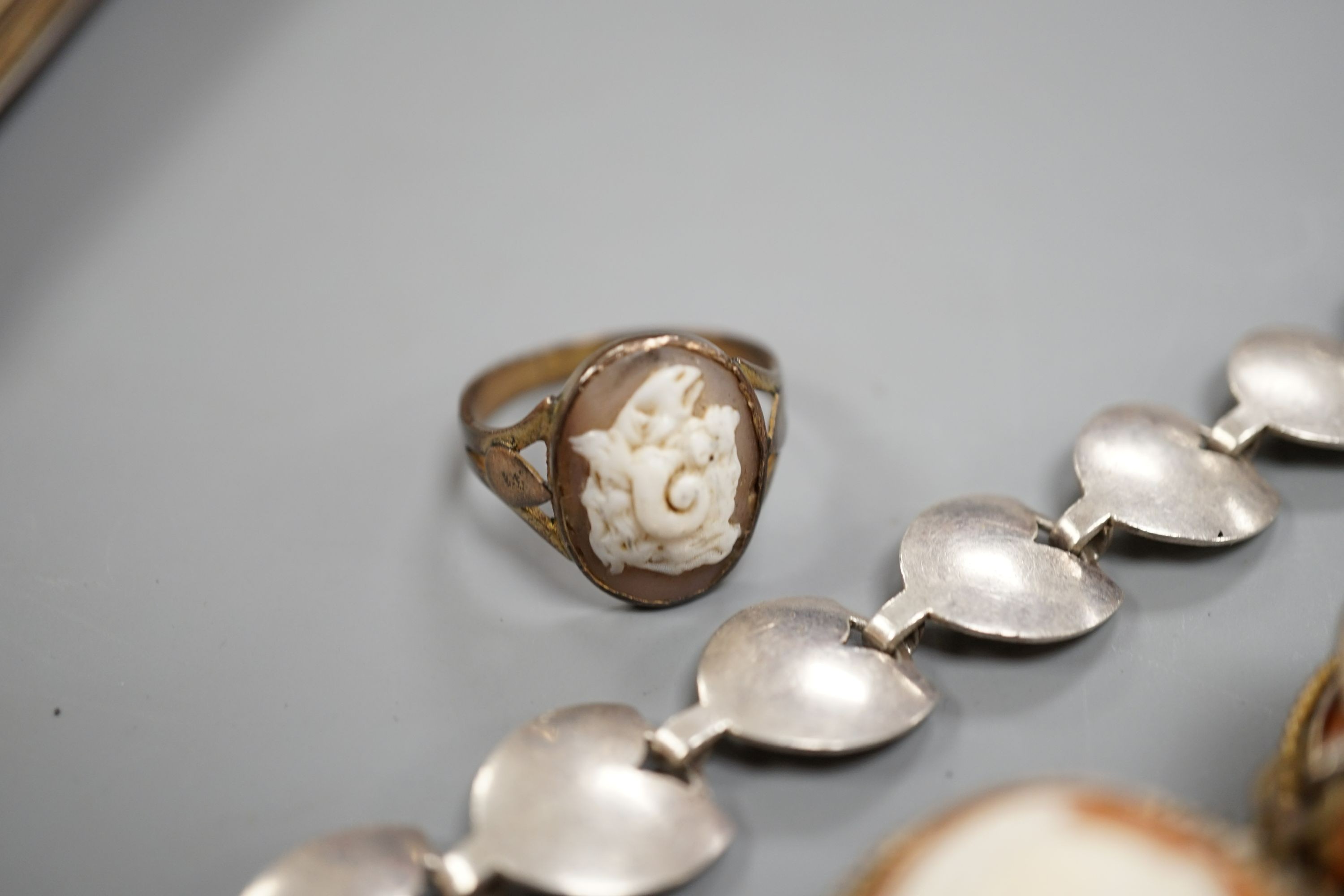 A gilt white metal and cameo shell set bracelet, a similar ring and a sterling 925 bracelet.